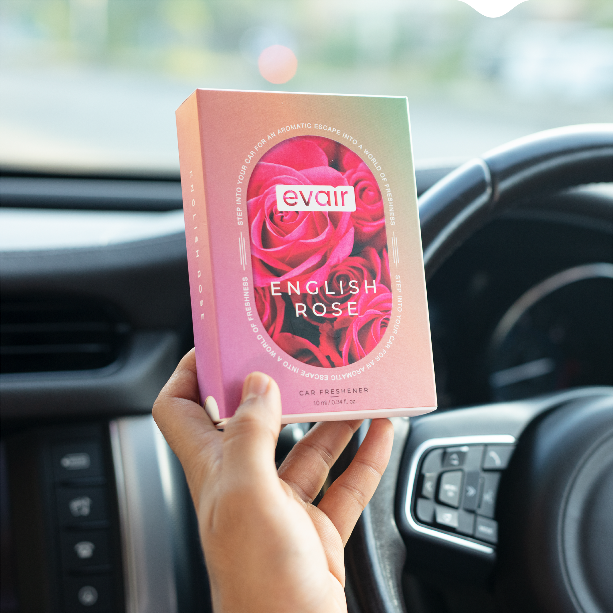 Men Holding Evair English Rose Long lasting Car Perfume in car