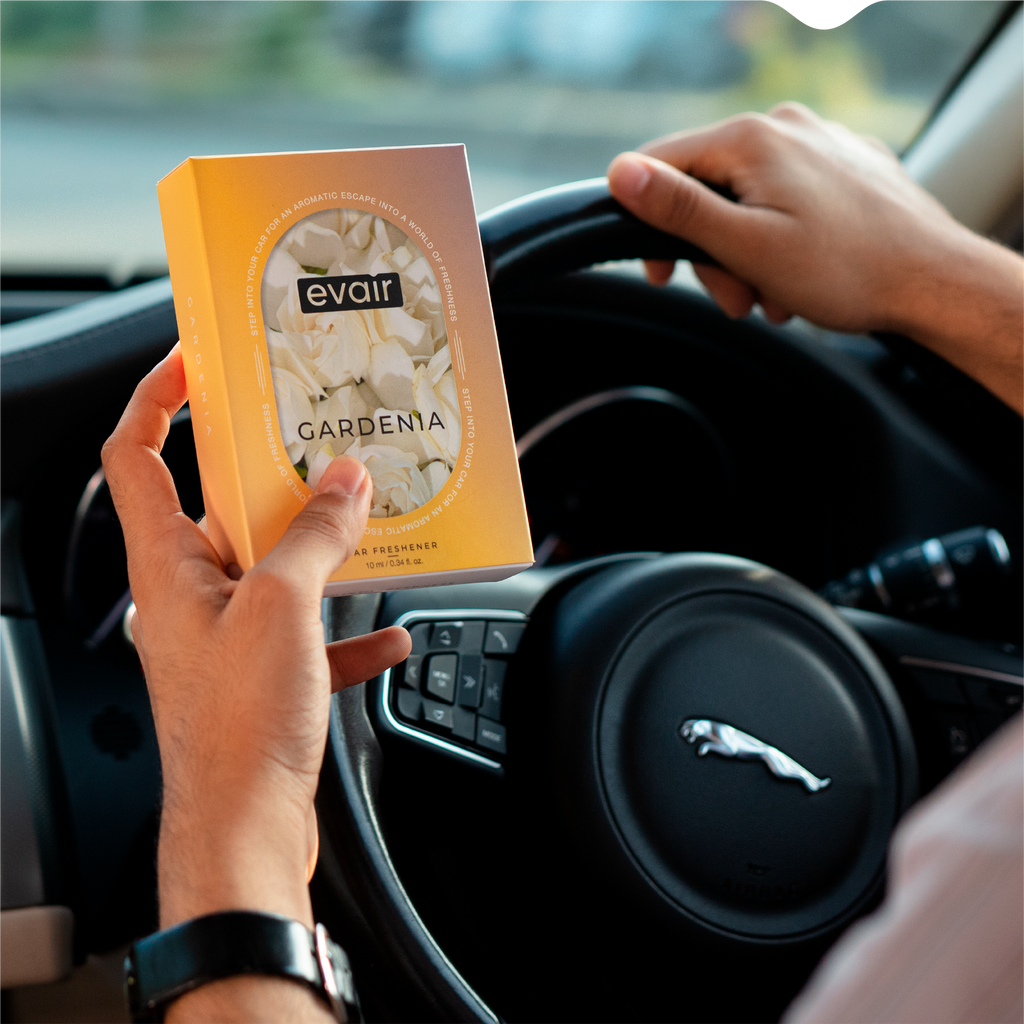 Men Holding Evair Gardenia Long lasting Car Perfume in car