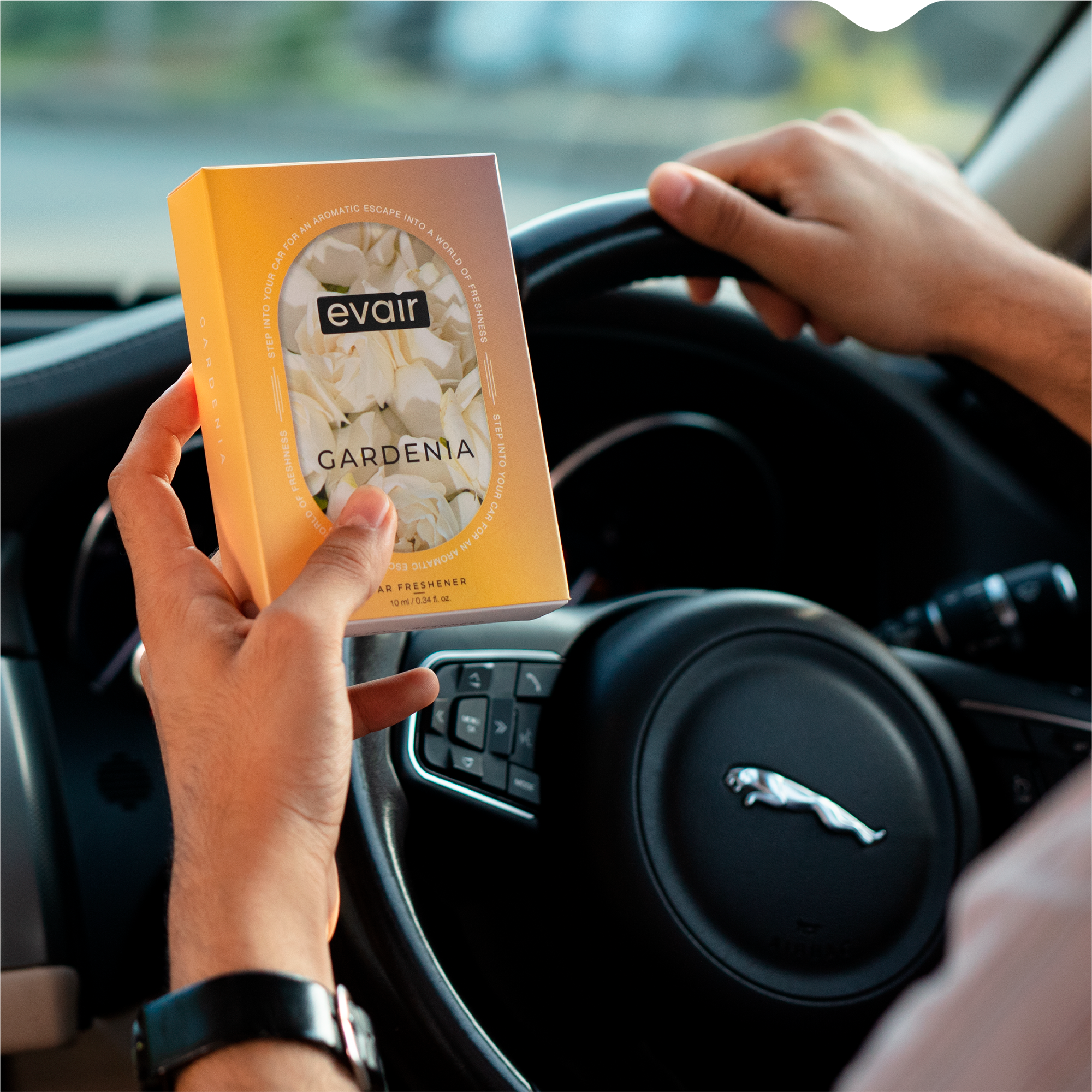 Men Holding Evair Gardenia Long lasting Car Perfume in car