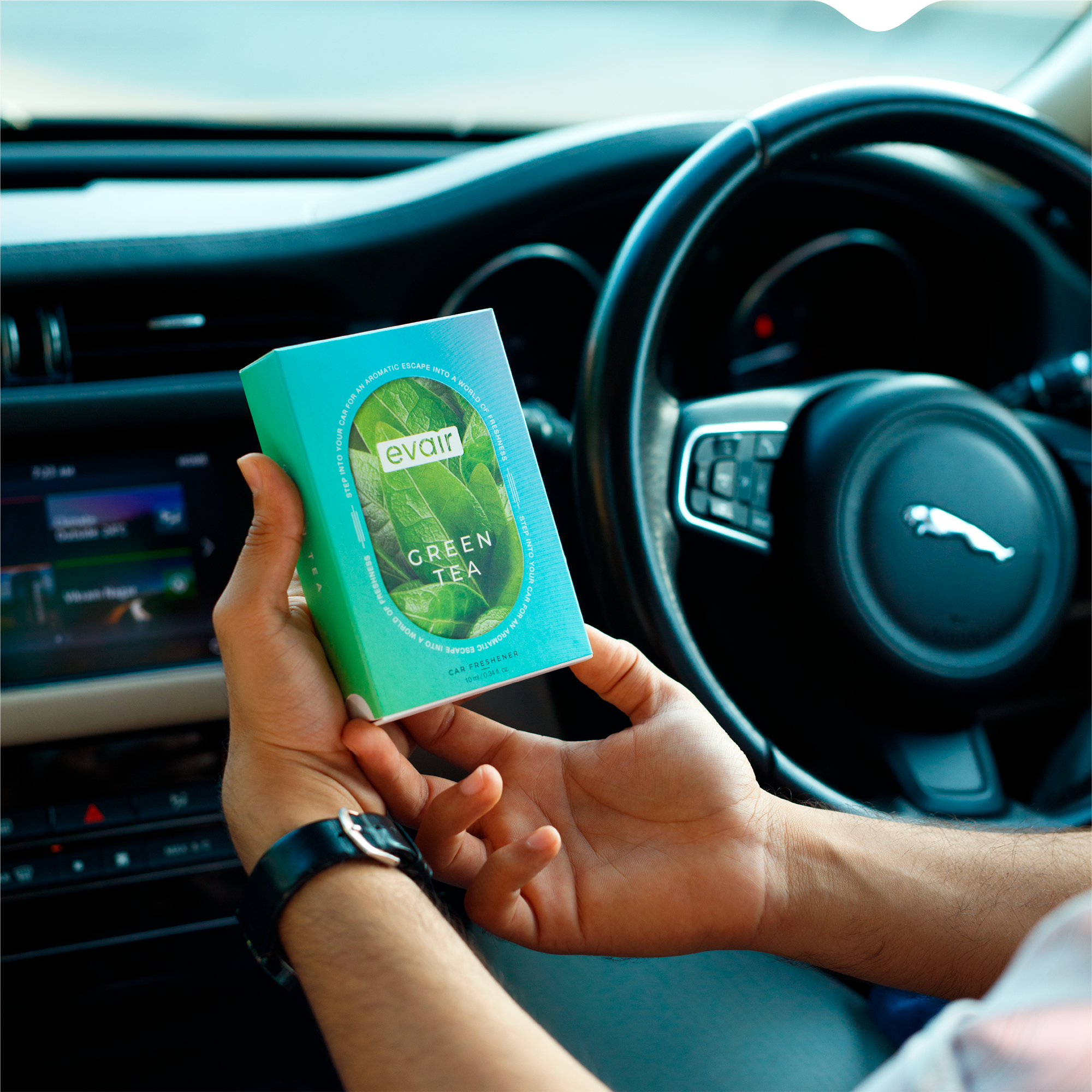 Men Holding Evair Green Tea Long lasting Perfume Car in car