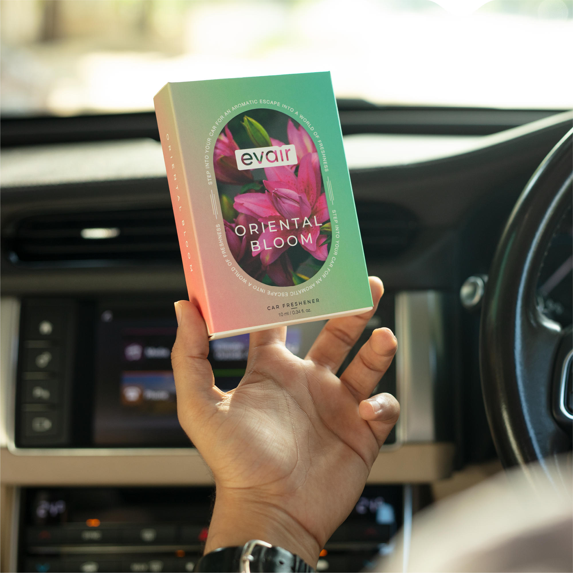 Men Holding Evair Oriental Bloom Long lasting Car Perfume in car