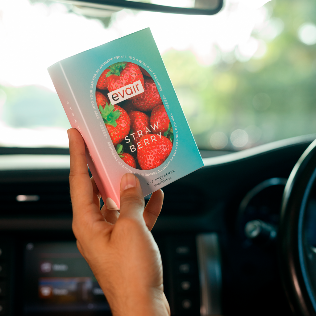 Men Holding Evair Strawberry Long lasting Car Perfume in car