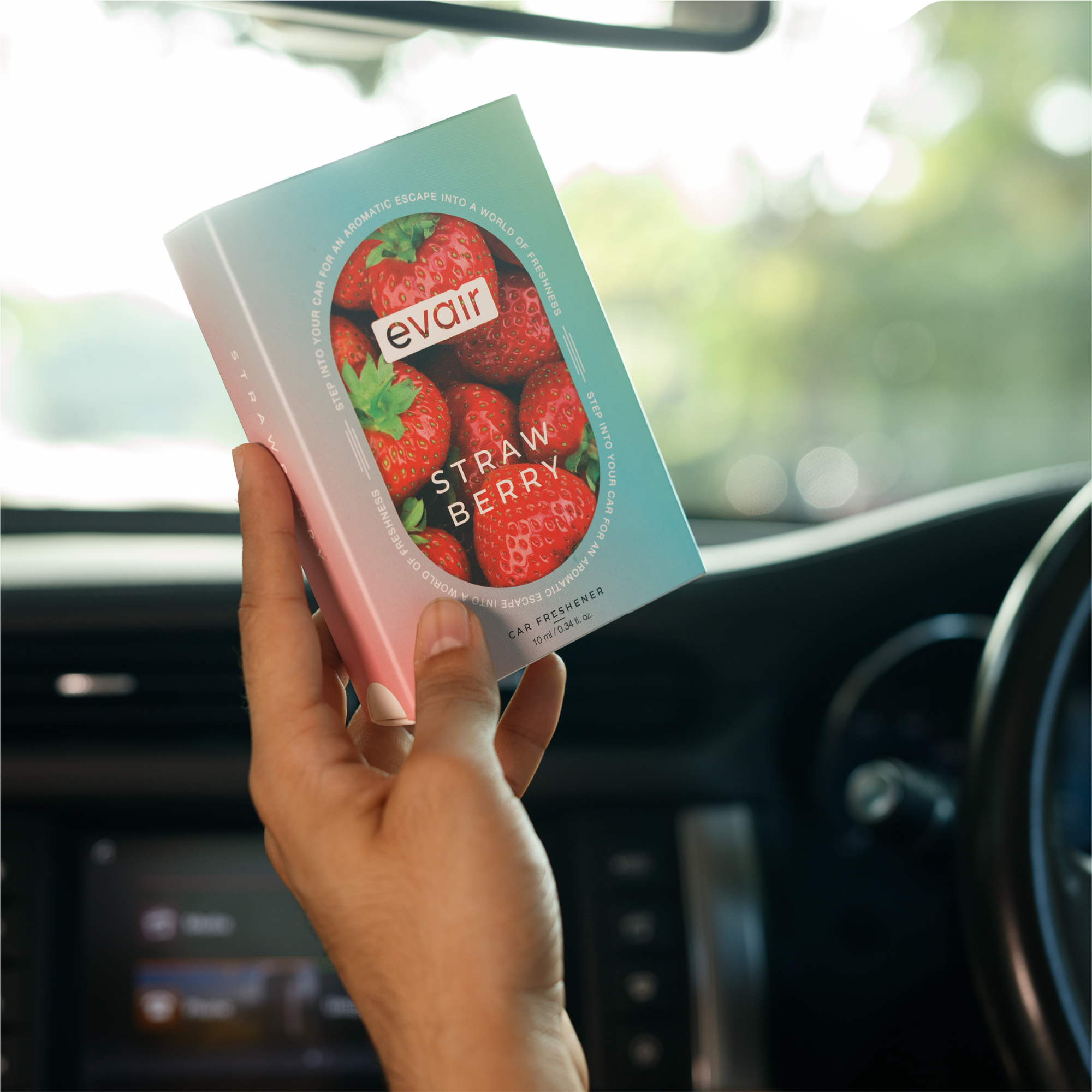 Men Holding Evair Strawberry Long lasting Car Perfume in car